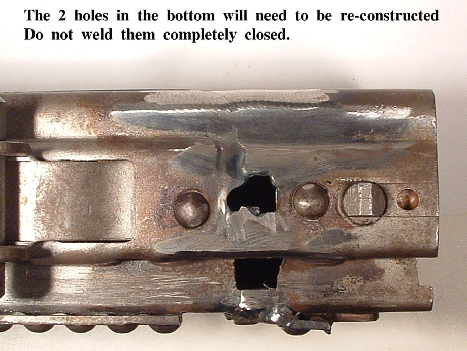 bottom rear, 2 holes that need to be reconstructed.