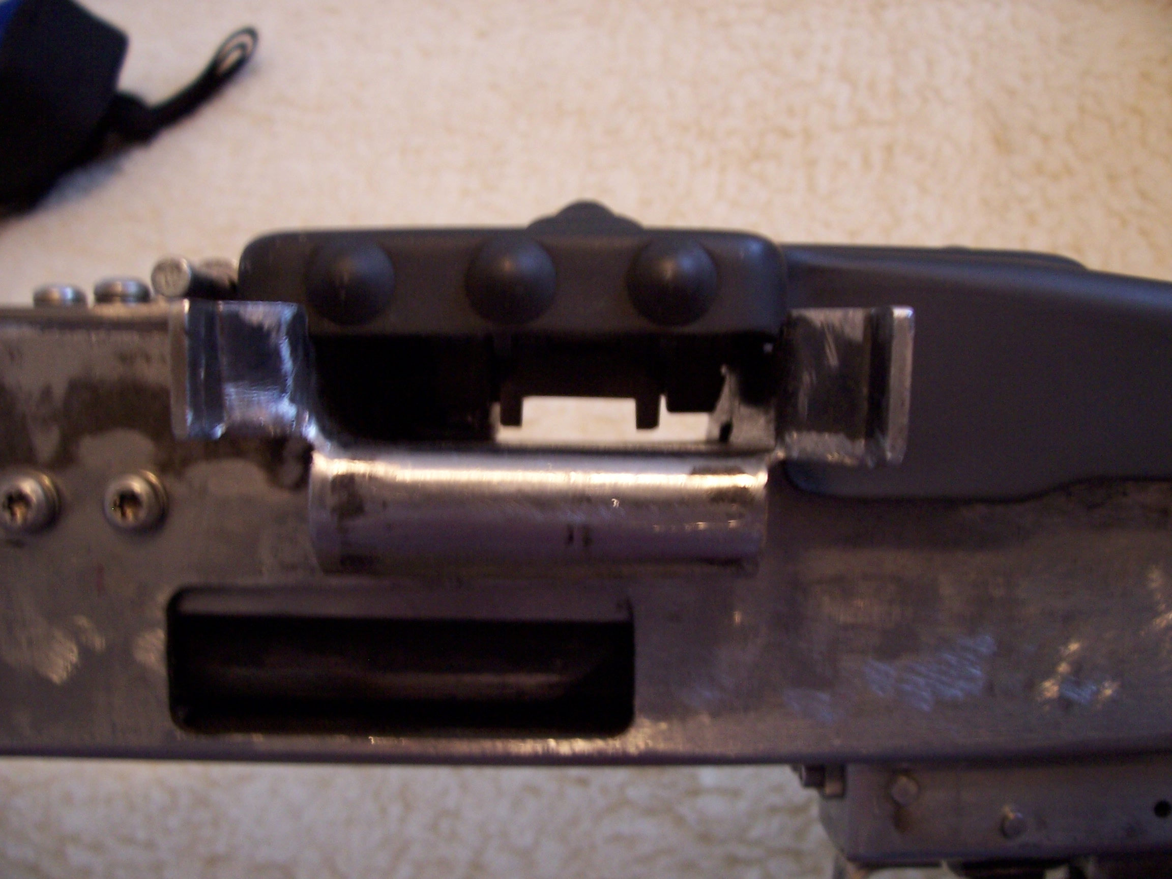 REDUCED THE FEED PAWL TO FEED TRAY DISTANCE.
